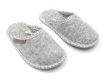 Children’s slippers made of natural felt have a thin rubber sole